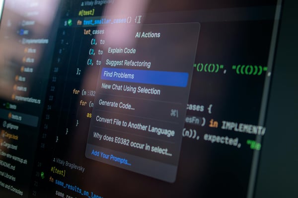 Detailed view of a computer screen displaying code with a menu of AI actions, illustrating modern software development.